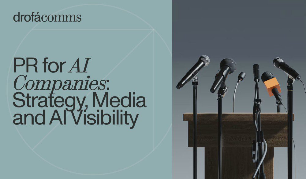 Microphones on a wooden podium at a press briefing, illustrating PR for AI companies.